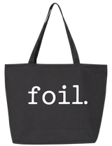 Black tote bag with 'foil.' text on a white background