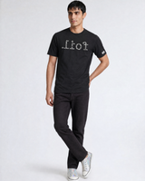 Man wearing a black t-shirt with 'Lion' printed on it against a white background